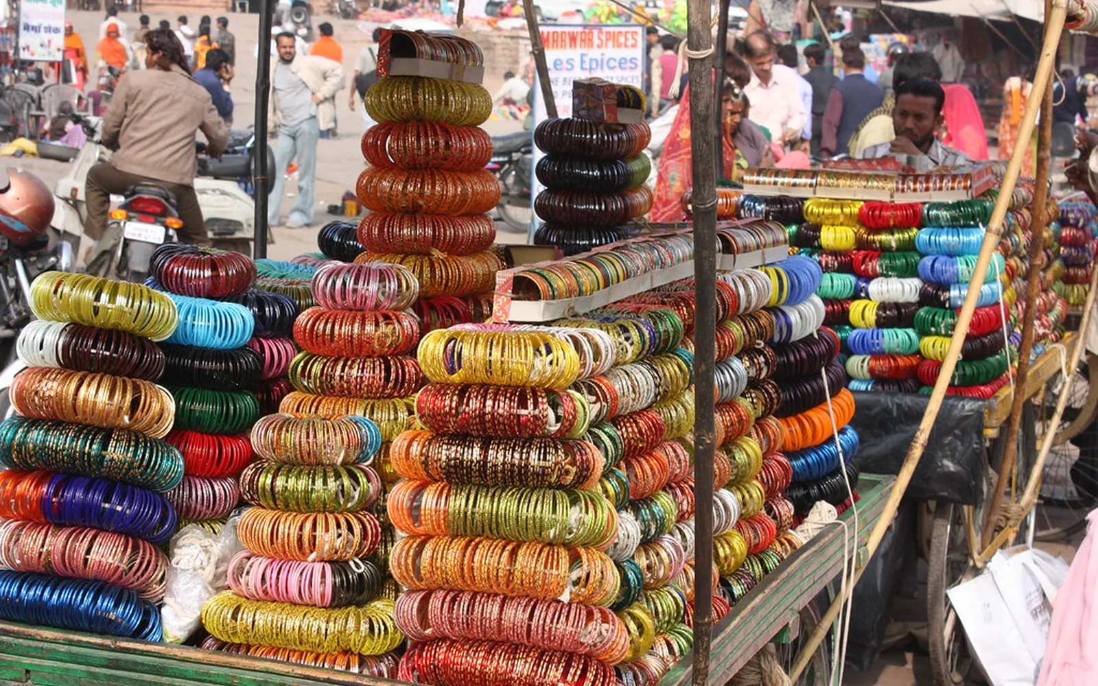Stalls stacked with colourful bangles in a busy Rajasthani bazaar